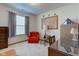 Bedroom featuring an orange chair, dark wooden desk, map and American flag at 118 Presidential Ct, Greenfield, IN 46140