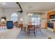 Open-concept dining area with a view into the living space and outdoor access at 118 Presidential Ct, Greenfield, IN 46140