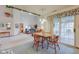 Dining space with access to living area, kitchen, and bright sliding glass door at 118 Presidential Ct, Greenfield, IN 46140