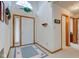 Bright foyer featuring tile floor, soaring ceiling and wooden trim at 118 Presidential Ct, Greenfield, IN 46140