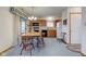 Bright kitchen and dining area with classic cabinets and access to the outdoors at 118 Presidential Ct, Greenfield, IN 46140