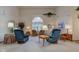 Spacious living room filled with natural light, featuring carpet flooring and vaulted ceiling at 118 Presidential Ct, Greenfield, IN 46140