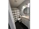 Cozy bathroom featuring a vanity with granite top, a toilet, and a shower with striped curtain at 12458 Trumbull Ct, Fishers, IN 46038