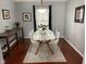 Bright dining area featuring modern table, chairs, and stylish decor on hardwood floors at 12458 Trumbull Ct, Fishers, IN 46038