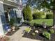 Inviting front yard with lush landscaping, a charming walkway, and a welcoming entrance at 12458 Trumbull Ct, Fishers, IN 46038