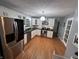 Modern kitchen with stainless steel appliances and white cabinetry at 12458 Trumbull Ct, Fishers, IN 46038