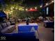 Outdoor patio area featuring patio furniture, string lights, and a well-maintained outdoor grill at 12458 Trumbull Ct, Fishers, IN 46038