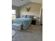Relaxing bedroom featuring a large window, plush rug, and neutral decor at 12802 Ari Ln, Fishers, IN 46037