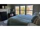 Bedroom features a large window, and a makeup vanity and chair at 12802 Ari Ln, Fishers, IN 46037