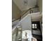 Inviting foyer with staircase, wood railing, decorative mirror and views into the living room at 12802 Ari Ln, Fishers, IN 46037