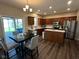 Spacious kitchen and dining area featuring wood cabinets, stainless steel appliances and lots of light at 12802 Ari Ln, Fishers, IN 46037