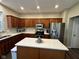 Charming kitchen features stainless steel appliances, granite countertops, and wood cabinets at 12802 Ari Ln, Fishers, IN 46037