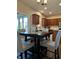 Modern kitchen featuring wood cabinets, stainless steel appliances, and an adjacent dining area at 12802 Ari Ln, Fishers, IN 46037