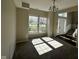 Bright, carpeted living room featuring large windows letting in sunlight and views of the front yard at 12802 Ari Ln, Fishers, IN 46037
