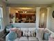 Comfortable living room showing a view to the kitchen, decorative pillows and lots of light at 12802 Ari Ln, Fishers, IN 46037