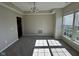 Open living room with carpet, neutral paint and view to the windows for natural light at 12802 Ari Ln, Fishers, IN 46037