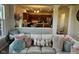 Comfortable living room showing a view to the kitchen, decorative pillows and lots of light at 12802 Ari Ln, Fishers, IN 46037