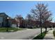 A quiet residential street with well-maintained homes and mature trees at 12802 Ari Ln, Fishers, IN 46037