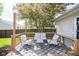 Inviting back deck with comfortable seating, perfect for outdoor relaxation and entertaining at 14203 Cliffwood Pl, Fishers, IN 46038