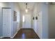 Bright entryway features wood floors, a coat closet, and stylish wall decor at 14203 Cliffwood Pl, Fishers, IN 46038
