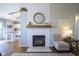 Cozy living room featuring a shiplap fireplace and neutral decor at 14203 Cliffwood Pl, Fishers, IN 46038