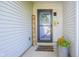 Cozy front porch with a welcome sign and decorative flower pot at 14203 Cliffwood Pl, Fishers, IN 46038