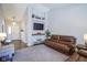 Open living room with modern decor and a view of the front entrance at 14203 Cliffwood Pl, Fishers, IN 46038