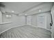 Spacious basement with new flooring, modern paint and walk out to the backyard at 14538 Baldwin Ln, Carmel, IN 46032