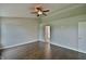 Bright bedroom with laminate floors and doorway to the bathroom at 14538 Baldwin Ln, Carmel, IN 46032