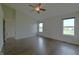 Bright bedroom with laminate floors and windows overlooking the yard at 14538 Baldwin Ln, Carmel, IN 46032