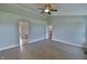 Bright bedroom with laminate floors and entrances to other rooms at 14538 Baldwin Ln, Carmel, IN 46032