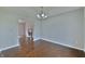 Open dining room with hardwood floors and a view of the fireplace in the next room at 14538 Baldwin Ln, Carmel, IN 46032