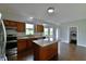 Spacious kitchen with granite countertops, stainless steel appliances, and center island at 14538 Baldwin Ln, Carmel, IN 46032