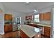 Gourmet kitchen with stainless steel appliances, granite counter tops and a center island at 14538 Baldwin Ln, Carmel, IN 46032