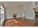 Spacious living room with wood floors, fireplace, and ample natural light at 14538 Baldwin Ln, Carmel, IN 46032