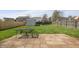 Spacious backyard with green lawn, brick patio, shed and playset at 14953 Lovely Dove Ln, Noblesville, IN 46060