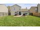 Spacious backyard featuring a patio and lush green lawn, perfect for outdoor entertaining and relaxation at 14953 Lovely Dove Ln, Noblesville, IN 46060