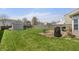 Green backyard with a shed, playset, patio, and covered grill at 14953 Lovely Dove Ln, Noblesville, IN 46060
