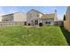 Wide green backyard with patio, grill, and fenced border at 14953 Lovely Dove Ln, Noblesville, IN 46060