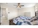 Bedroom featuring a large wooden bed frame, carpeted floors, and natural light at 14953 Lovely Dove Ln, Noblesville, IN 46060