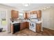 Kitchen with stainless steel appliances, tile backsplash, and natural light from a window overlooking the backyard at 14953 Lovely Dove Ln, Noblesville, IN 46060