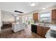 Bright kitchen boasts an island, stainless steel appliances, and a view into an adjacent living room and backyard at 14953 Lovely Dove Ln, Noblesville, IN 46060