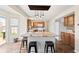 Well-equipped kitchen with granite island, pendant lighting, and ample cabinet space at 14953 Lovely Dove Ln, Noblesville, IN 46060