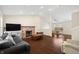 Inviting living room featuring a stone fireplace, vaulted ceilings, and hardwood floors at 14953 Lovely Dove Ln, Noblesville, IN 46060