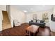 Bright living room showcasing hardwood floors, a staircase, and comfortable furniture at 14953 Lovely Dove Ln, Noblesville, IN 46060