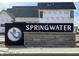 Springwater community sign with stone base, set against backdrop of new construction at 16387 Burlwood Dr, Westfield, IN 46074