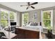 Bedroom with natural light, a ceiling fan, and a workstation with an adjacent desk at 1826 N Alabama St, Indianapolis, IN 46202