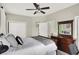 Comfortable bedroom with a ceiling fan, large closet, dresser, and bright natural light at 1826 N Alabama St, Indianapolis, IN 46202
