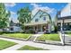 Beautiful two-story home with a welcoming front porch and well-maintained front yard and sidewalk at 1826 N Alabama St, Indianapolis, IN 46202