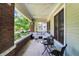 Relaxing front porch with outdoor seating, brick pillars, and string lights at 1826 N Alabama St, Indianapolis, IN 46202